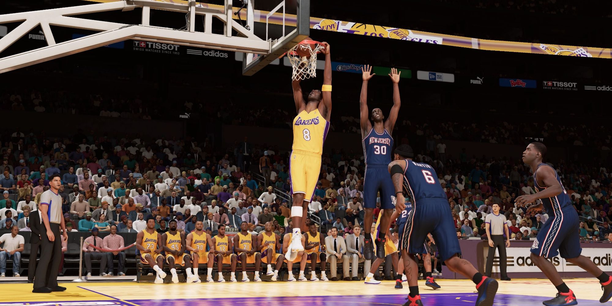 Kobe Bryant performing a dunk against the New Jersey Nets