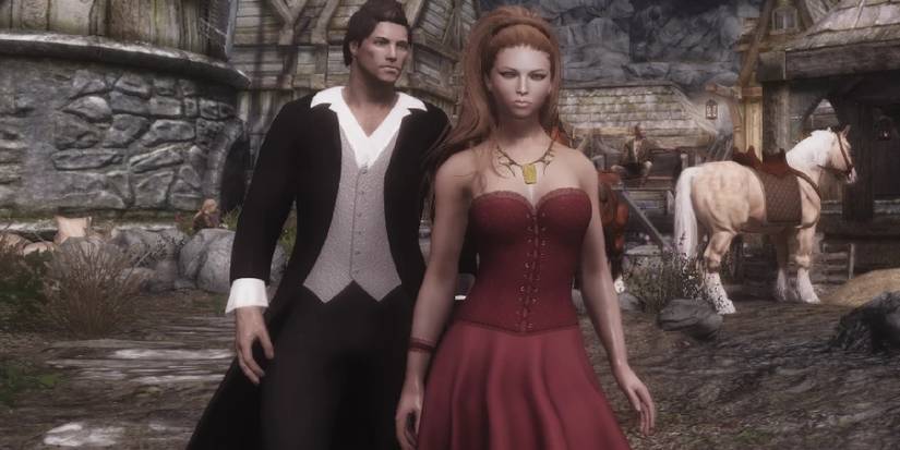 A male and female dragonborn side by side to demonstrate the romantic outfits for each gender.