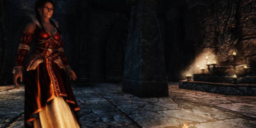 A modded dragonborn wearing the Philippa Eilhart dress from the Witcher.