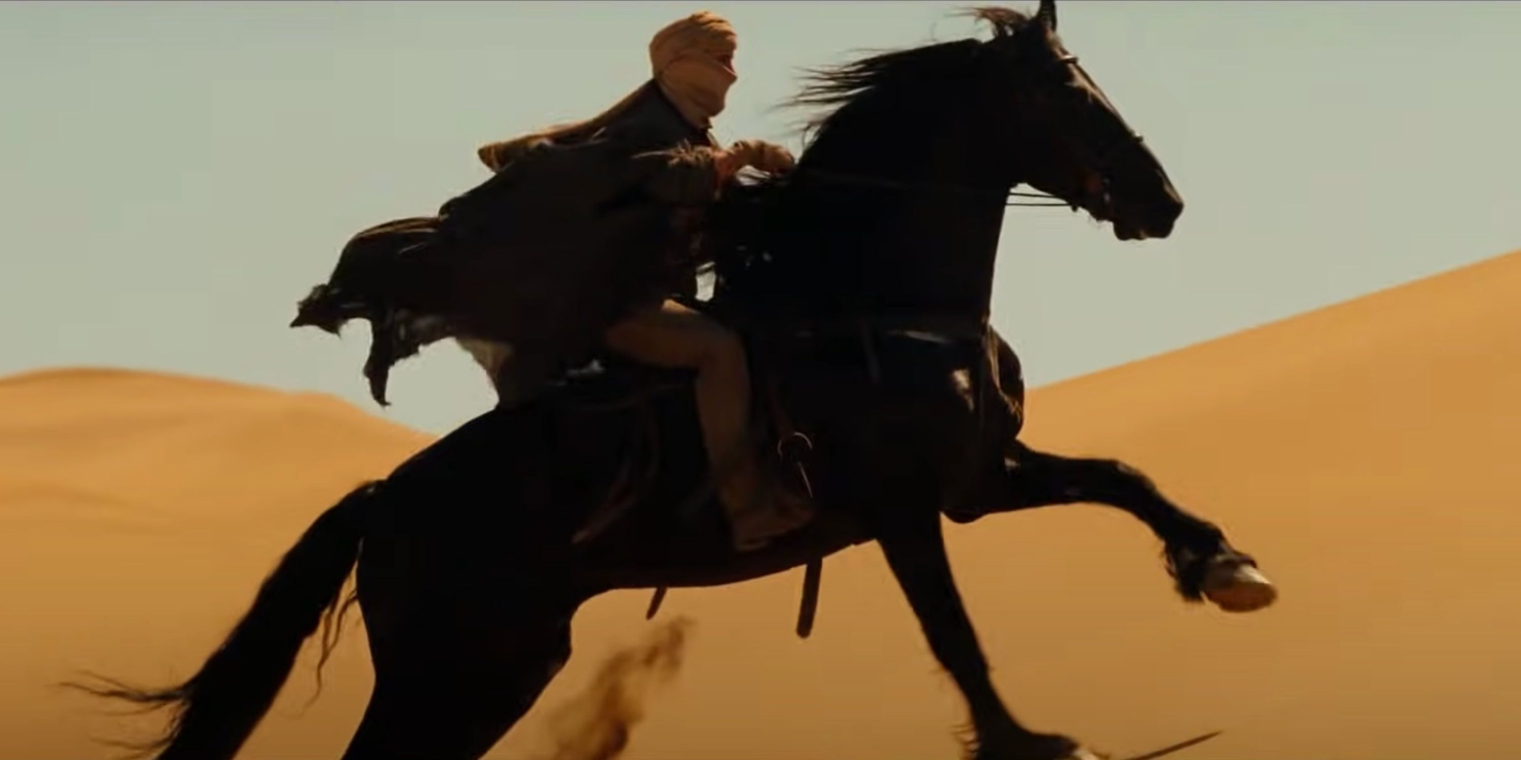 tom cruise riding a horse in the desert