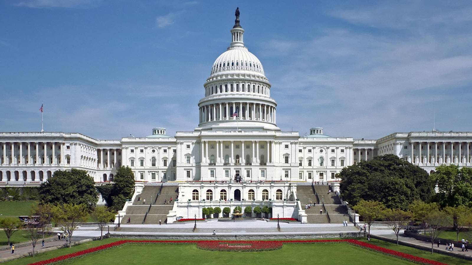 A photo of the United States House of Representives building during a sunny day.