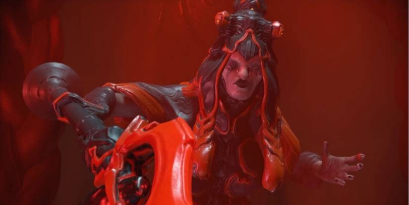 The Elder Grineer Queen wields her royal scepter in a War Within Quest cinematic.