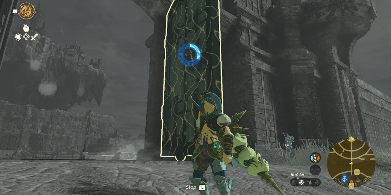 Link using recall on a tall door in front of Hyrule Castle in The Legend of Zelda: Tears of the Kingdom