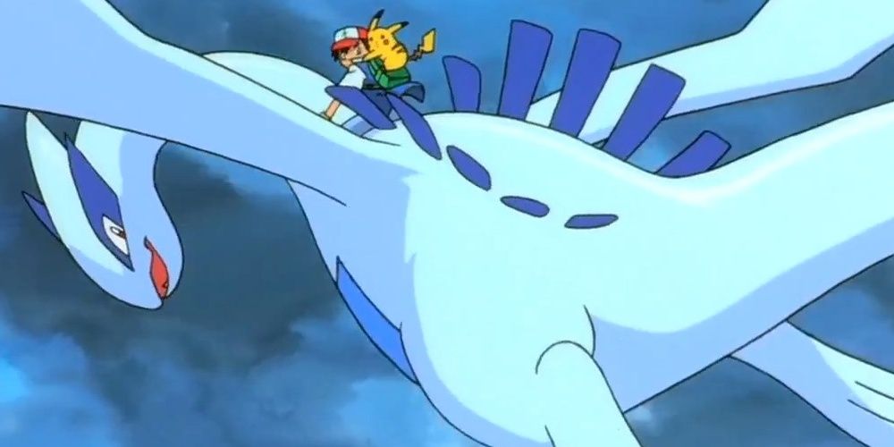 Ash y Pikachu cabalgando encima de Lugia