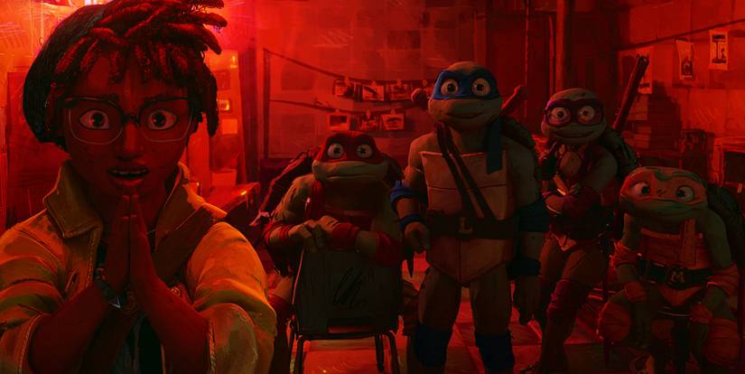 April and the turtles in a darkroom with pictures hanging in Mutant Mayhem