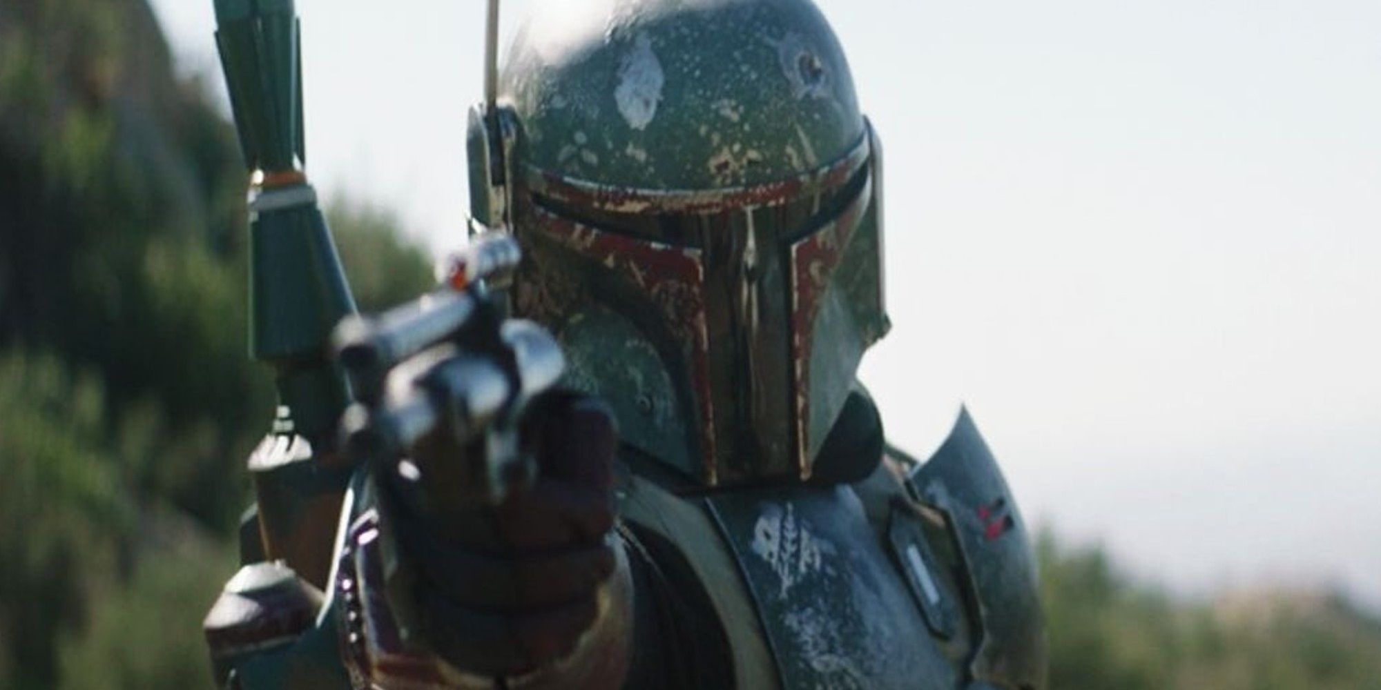 Boba Fett with a blaster in The Mandalorian Star Wars