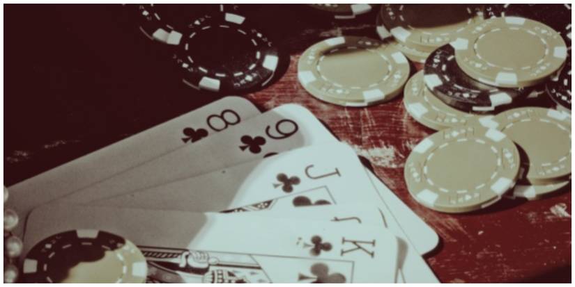 Poker hand and chips