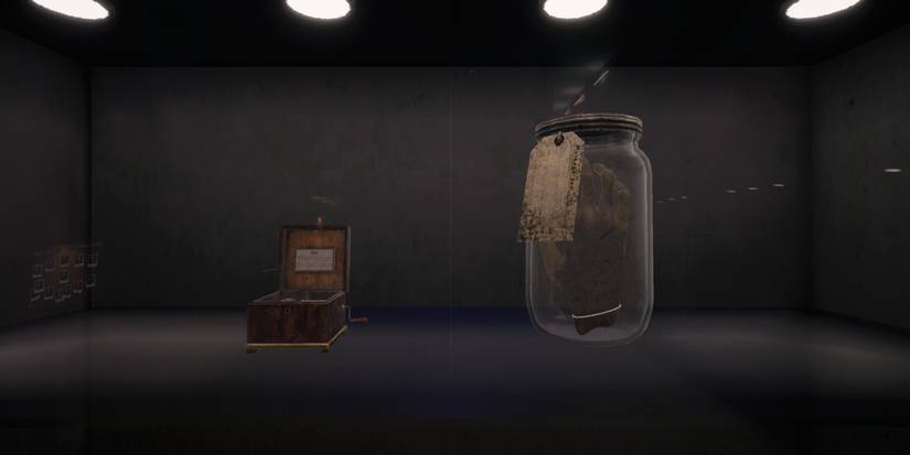 music box and monkey paw in a jar