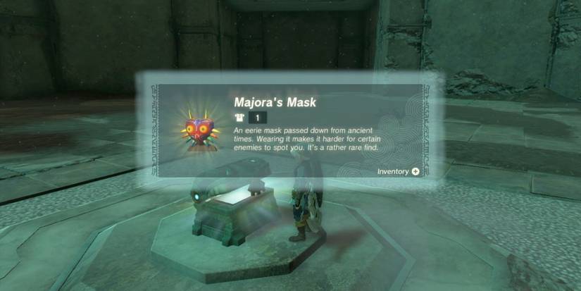 Link finding Majora's Mask in a treasure chest