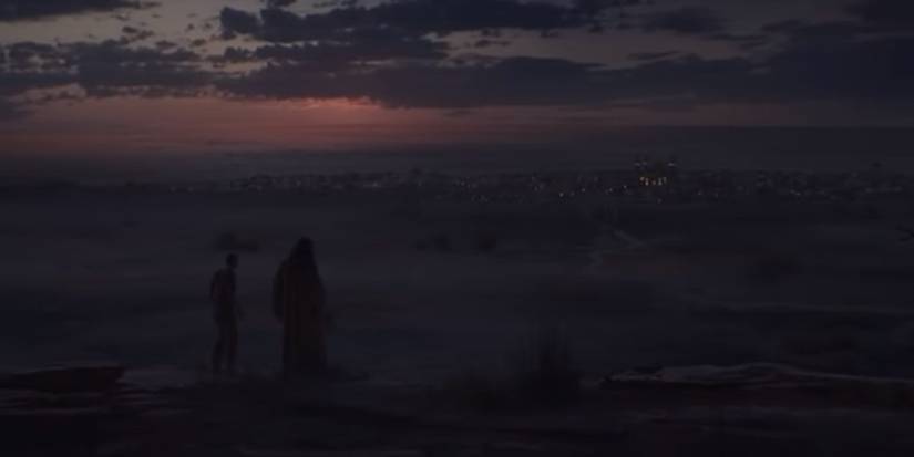 a cutscene from diablo 2 with characters standing on a mountain