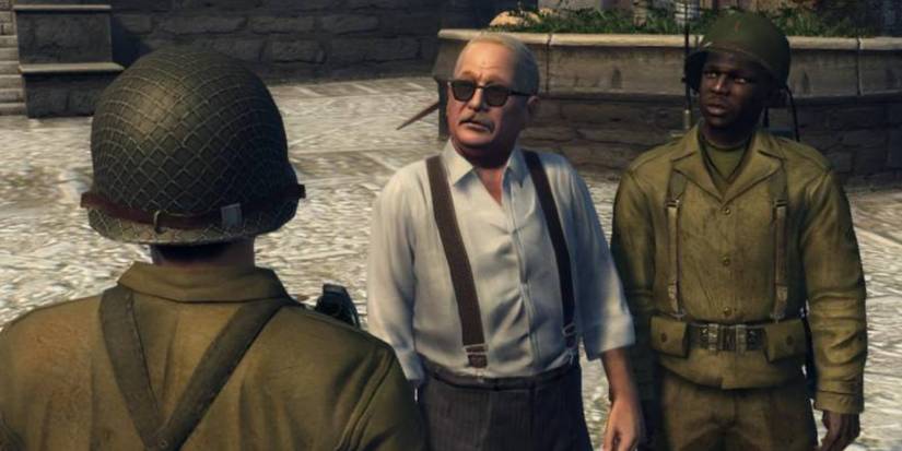 don calo  in a smart white suit with soldiers next to him