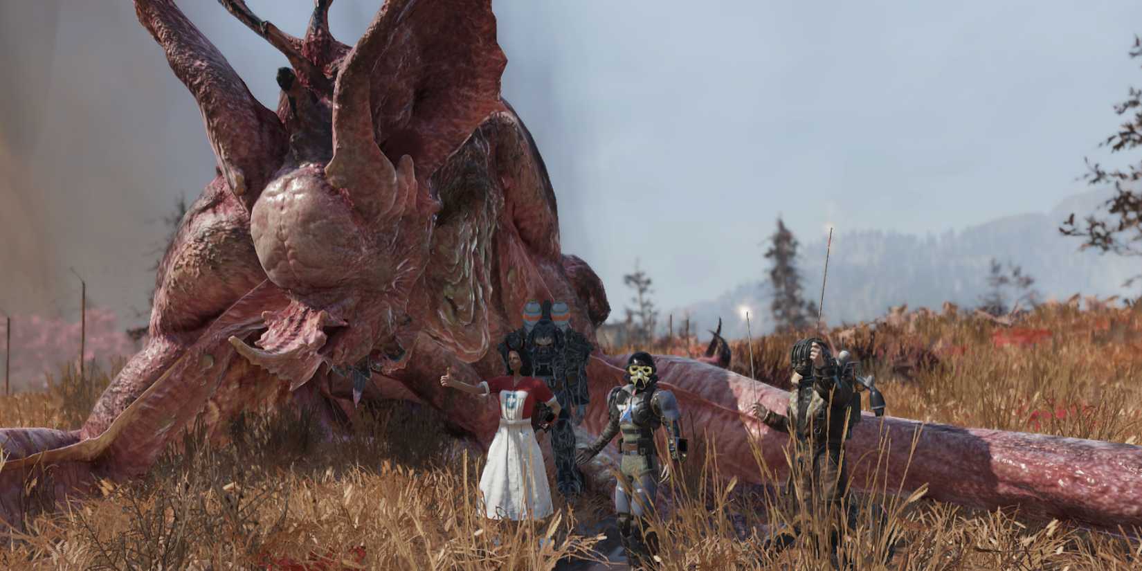 Fallout 76 Players Posing For Group Photo With Dead Scorchbeast Queen Raid Boss