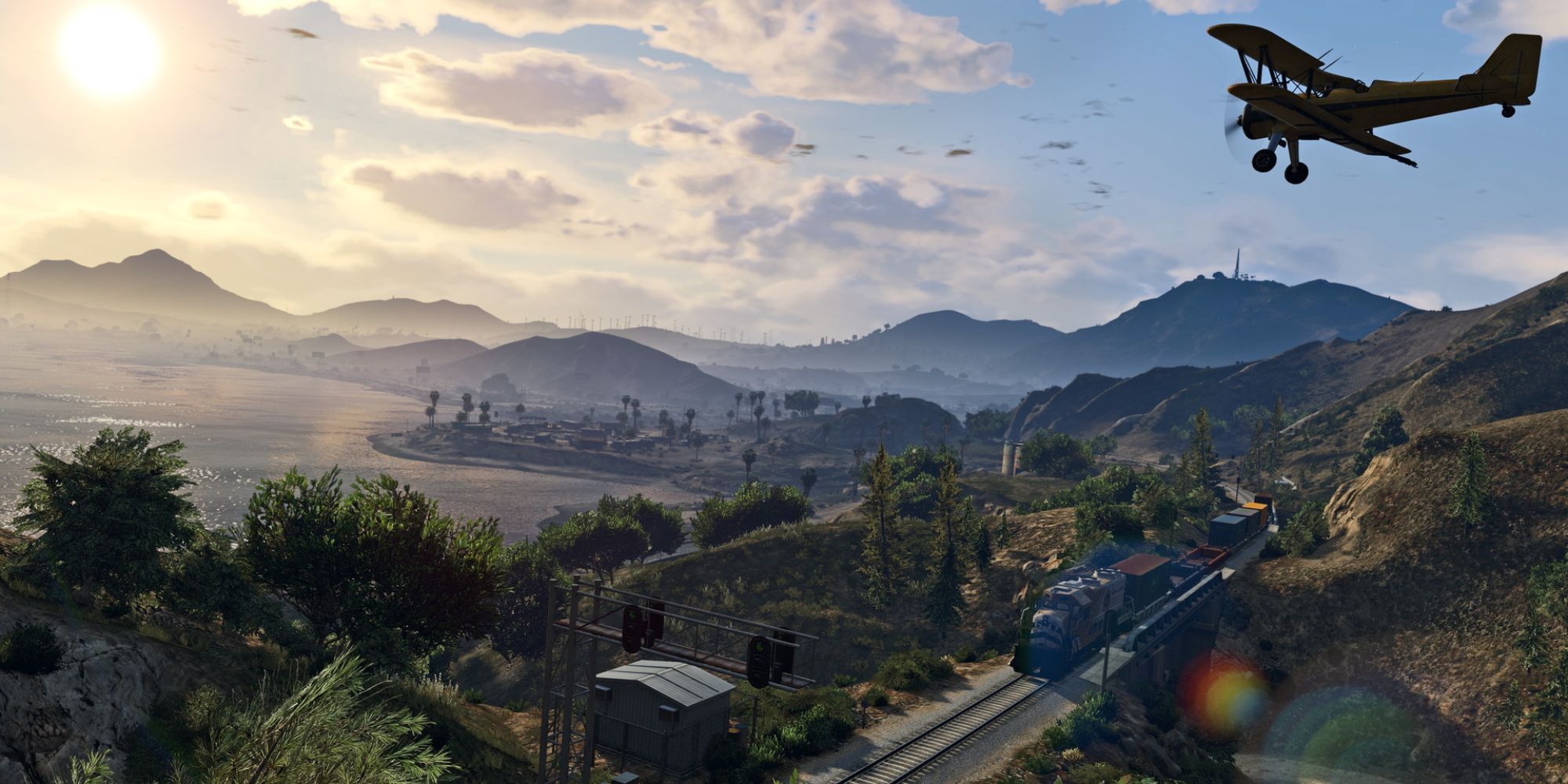 A landscape shot of Grand Theft Auto 5 with a plane flying over a train