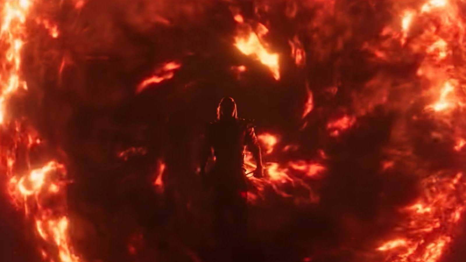 Silhouette of Shang Tsung emerging from a fiery portal in Mortal Kombat 1's trailer