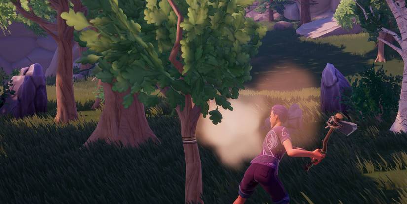 Cutting wood with Axe in Palia.