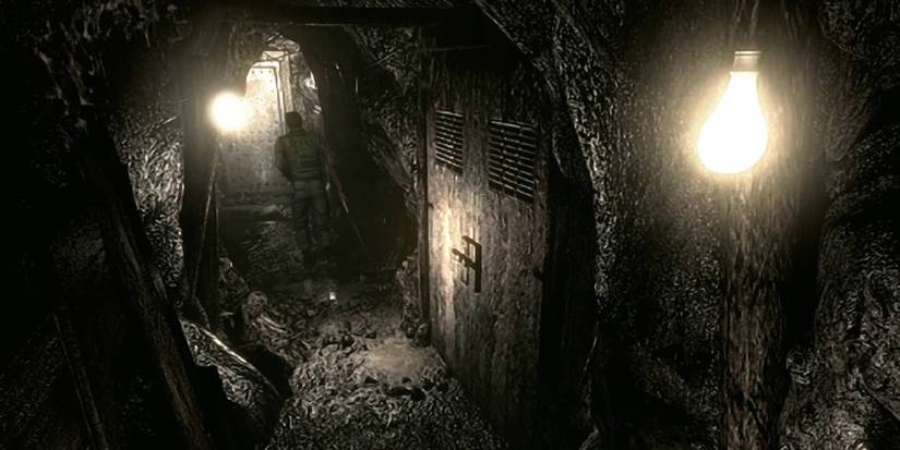 Chris running injured as he explores the underground tunnels, lit by a few naked bulbs.