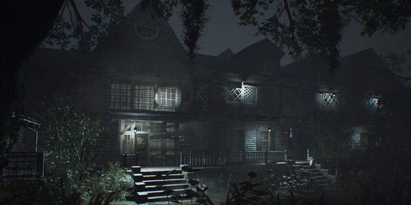 The outside of the Baker mansion at nighttime. 