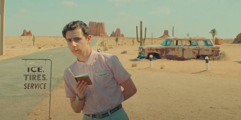 Asteroid City Boy looks down the road