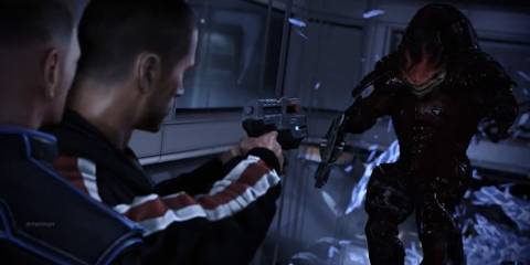 General Shepard pointing a gun at one of his crewmates.