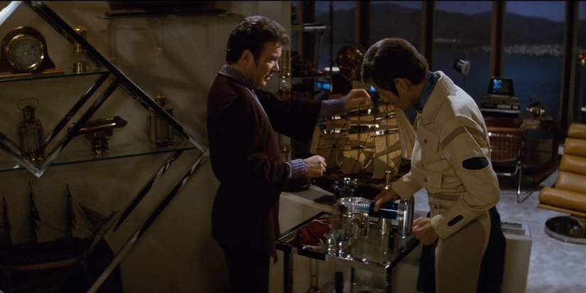 Doctor McCoy pours Kirk a glass of illegal Romulan ale.