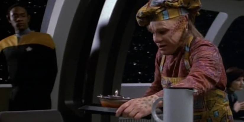 Neelix offers Tuvok some plomeek soup aboard the USS Voyager.