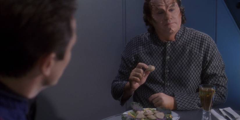 Star Trek Enterprise's Doctor Phlox eating a Denobulan Sausage.