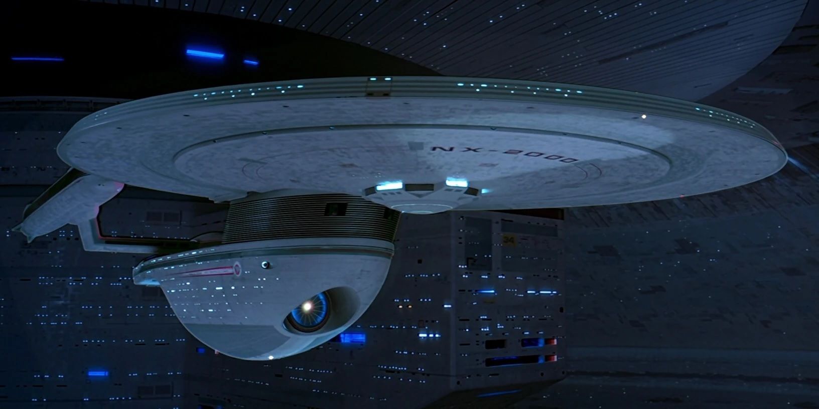 The USS Excelsior docked at a starbase.