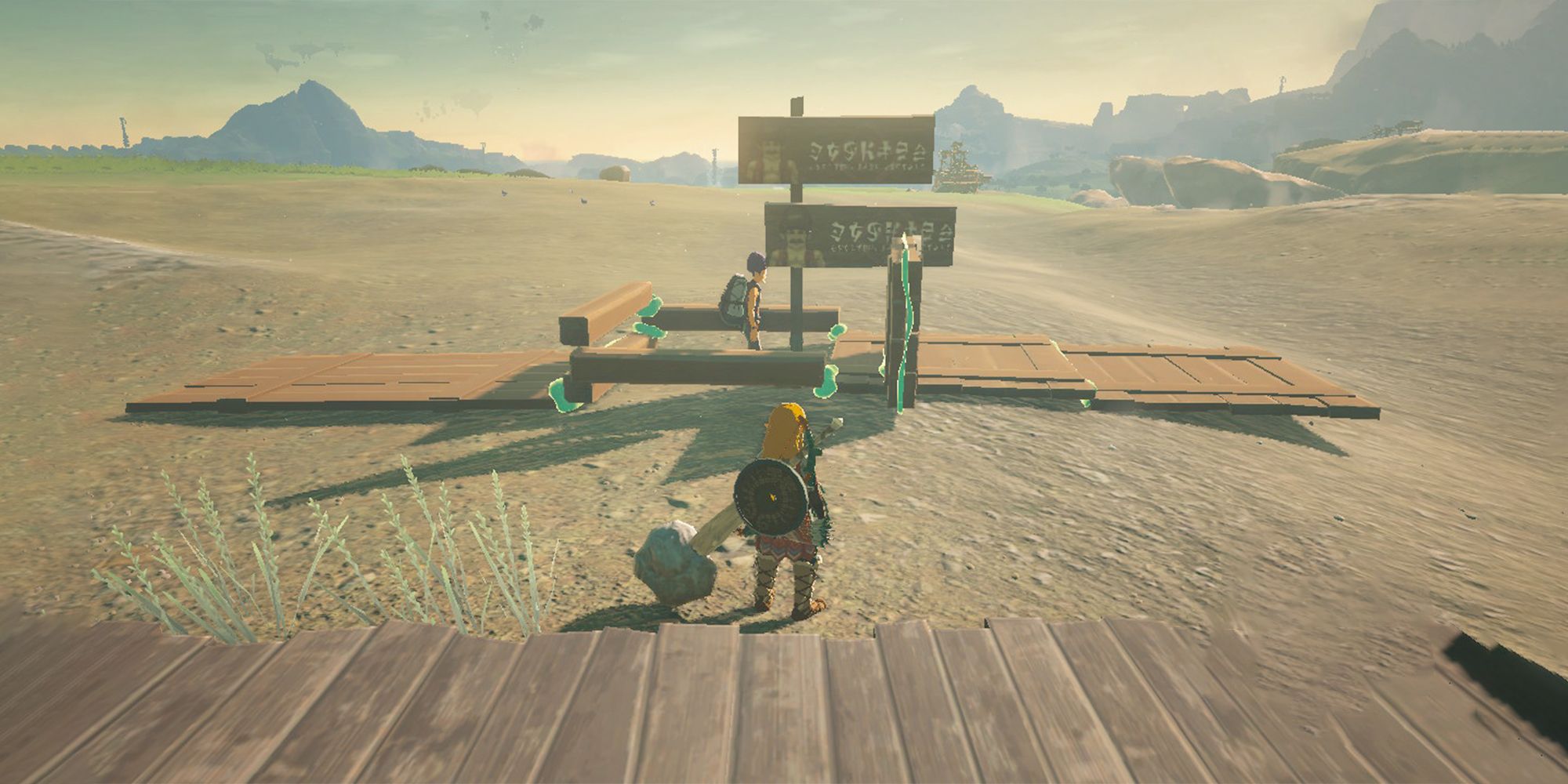 The Legend of Zelda Tears of the Kingdom Link standing in front of Addison and double President Hudson sign