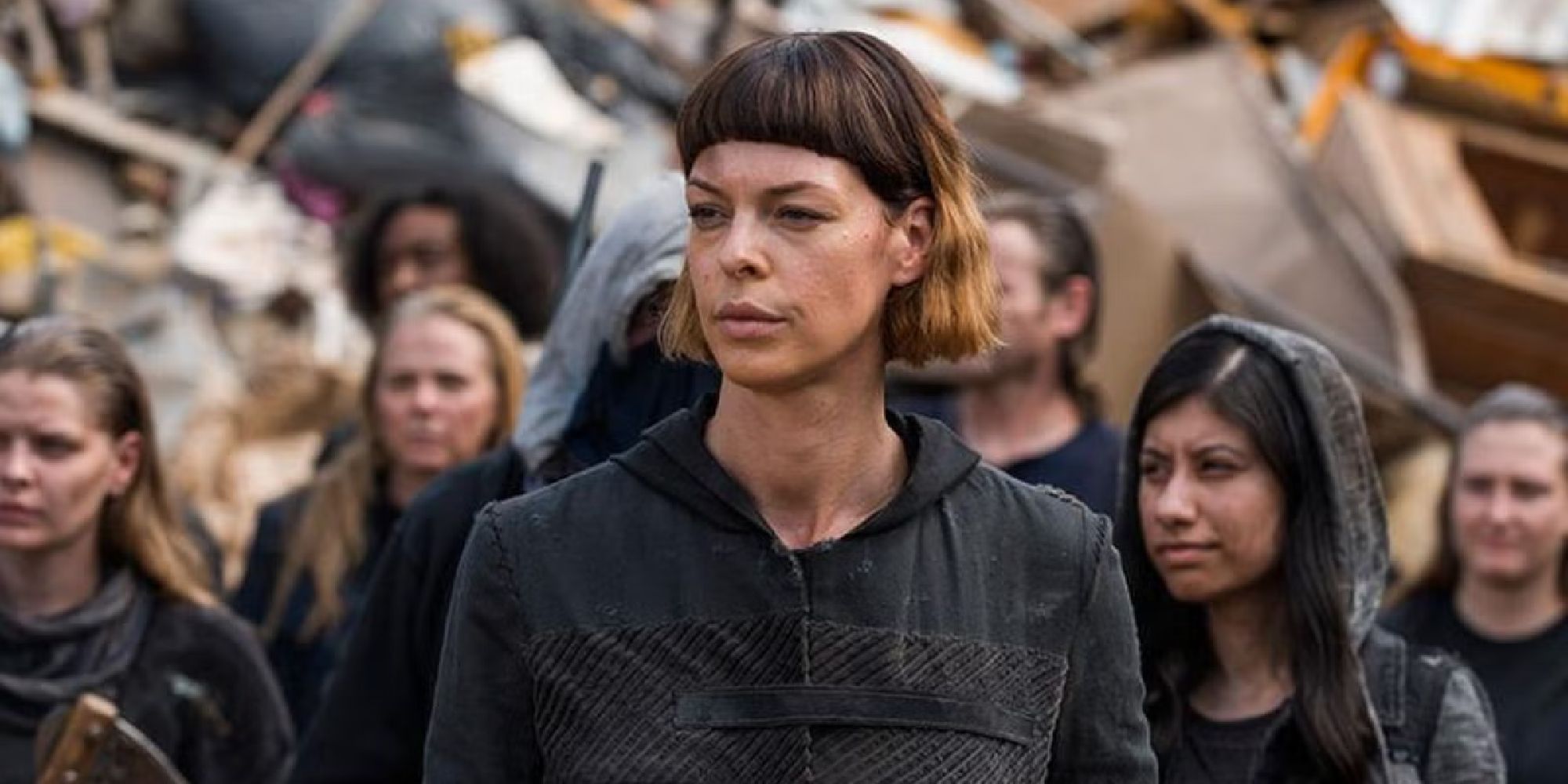 Jadis standing with the rest of the scavengers in The Walking Dead