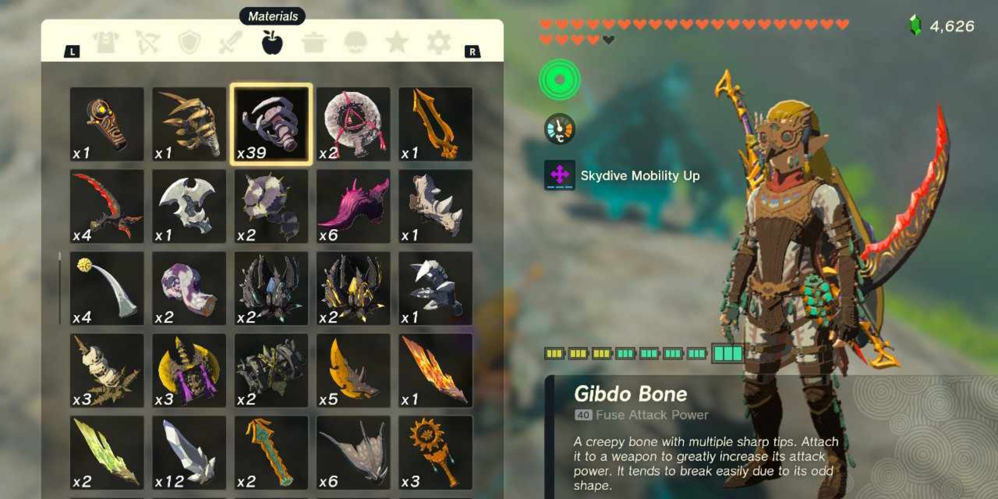 Link from Tears of the Kingdom stood beside his inventory, which is showing a Gibdo Bone