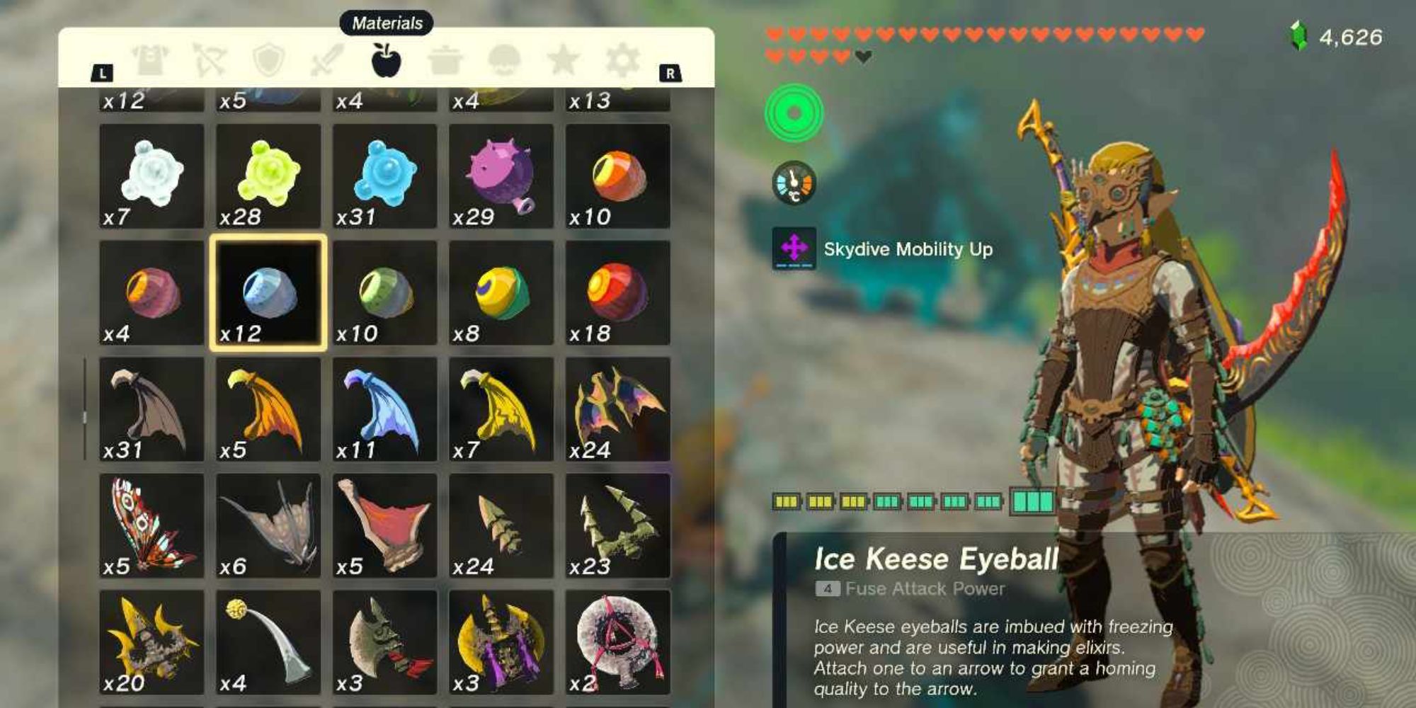 Link from Tears of the Kingdom stood beside his inventory, which is showing an Ice Keese Eyeball