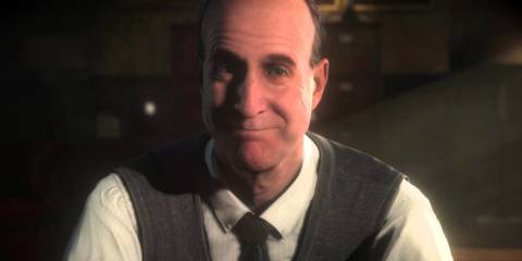 Dr hill smiling, in a smart suit