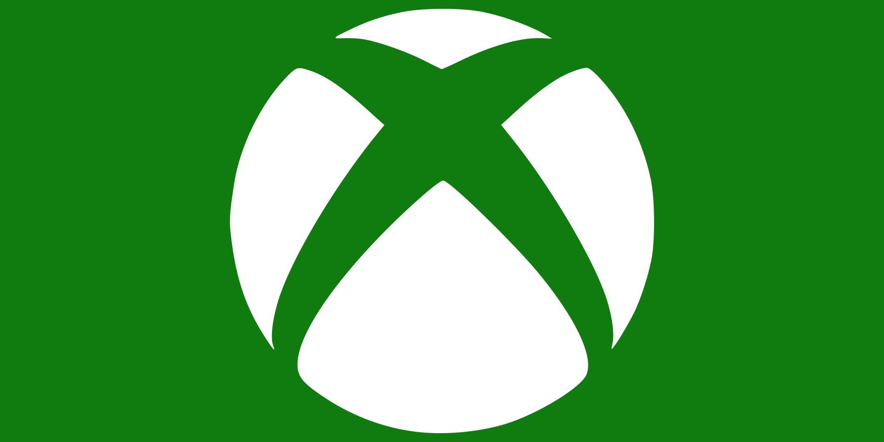 white Xbox logo emblem on dark green background