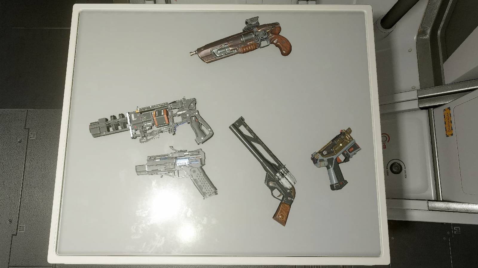 A set of pistols on a table in Starfield