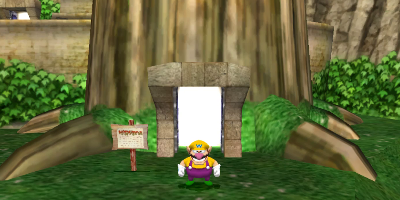 Wario standing by a tree in Wario World