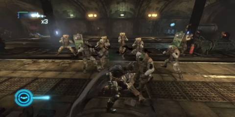 Batman beating an enemy in an underground location while other thugs prepare to fight