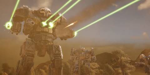 A Battletech mech shooting four green lasers into the distance with two mechs looking on.