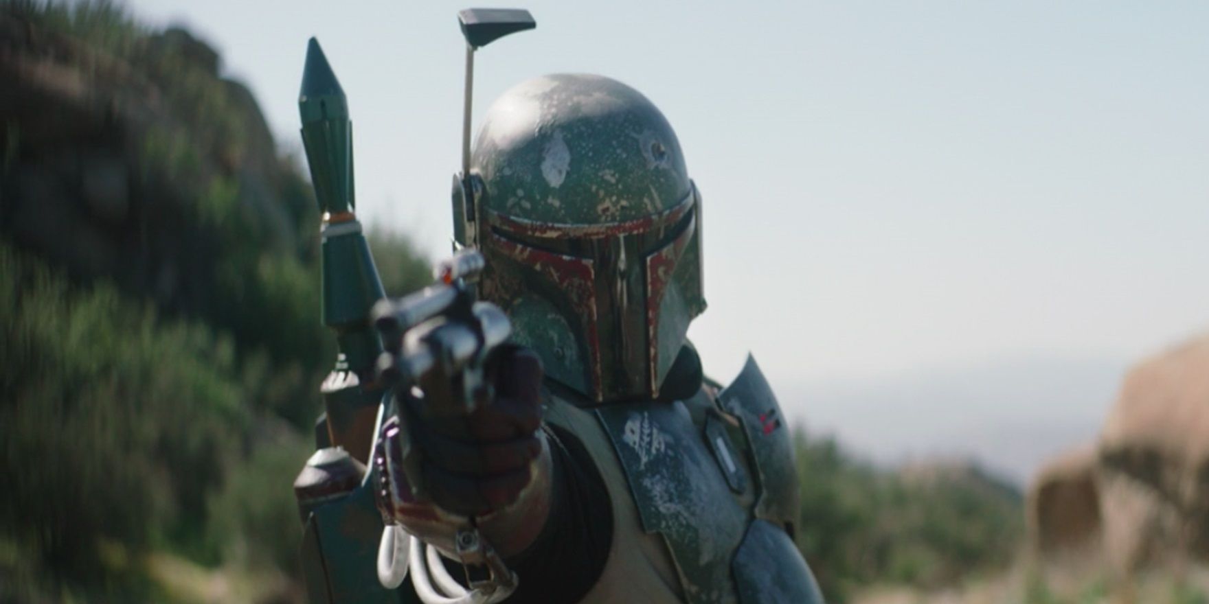 Boba Fett with a blaster in The Mandalorian