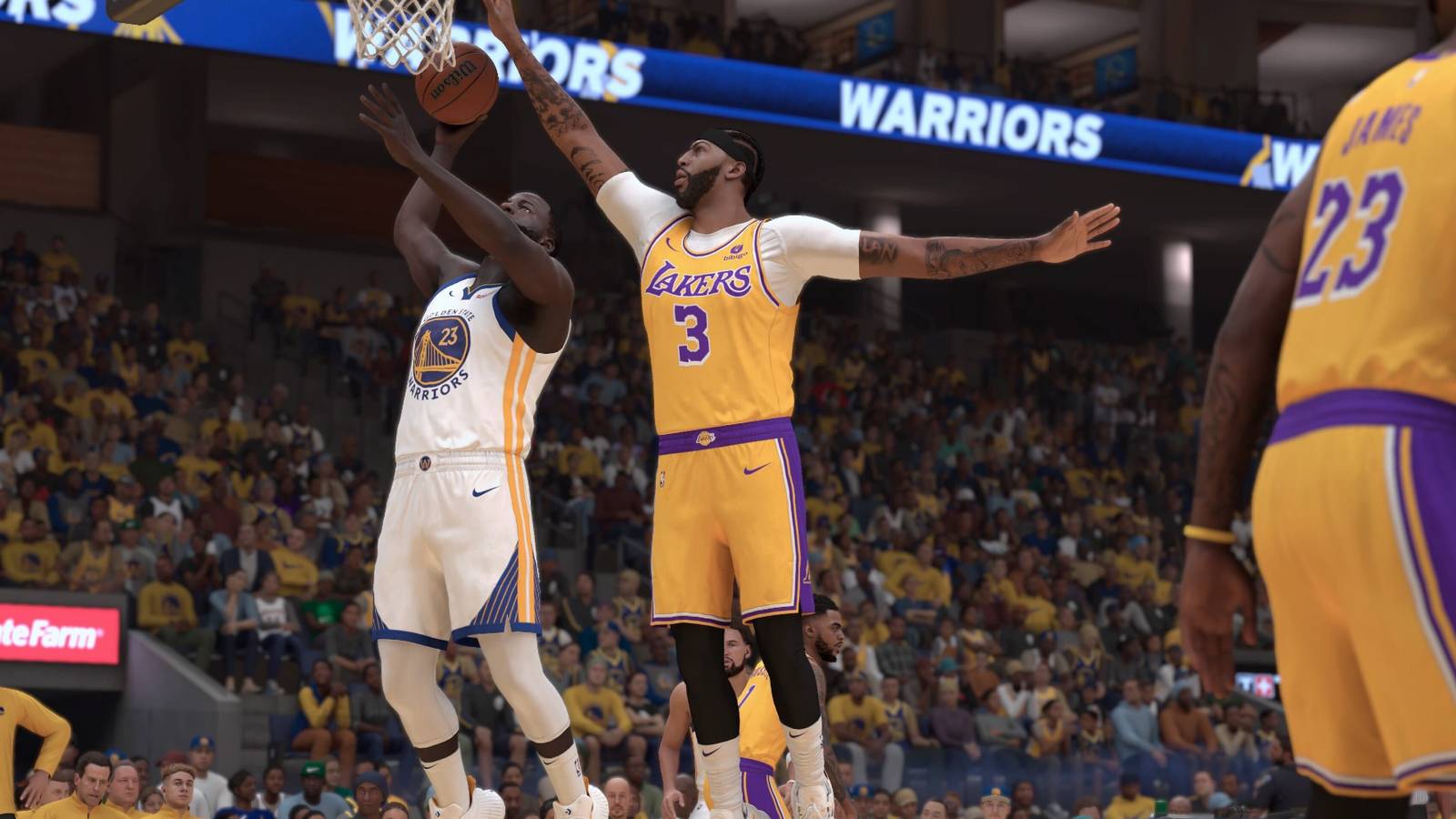 Anthony Davis attempting to block a dunk from Draymond Green in NBA 2K24