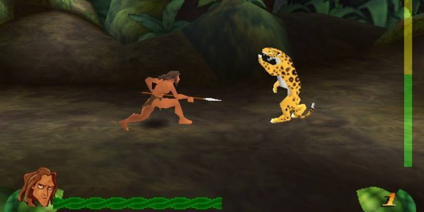 Tarzan pointing his spear at a jaguar in the Nintendo 64's Tarzan