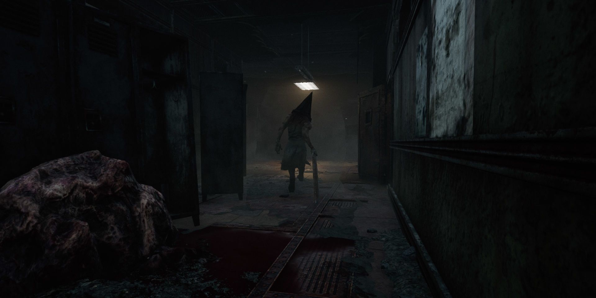 Pyramid head moving away hallway