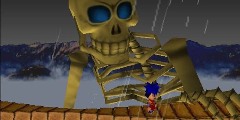 A giant skeleton staring down at Goemon as he walks across a shaky bridge in Goemon's Great Adventure