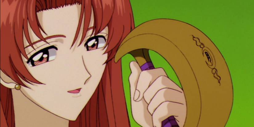 a red  haired woman holds something in her hand