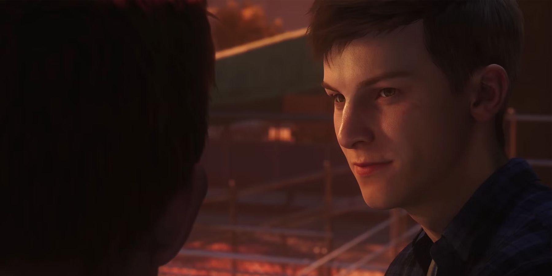 A screenshot of Peter Parker talking to Harry Osborn at sunset in Marvel's Spider-Man 2.