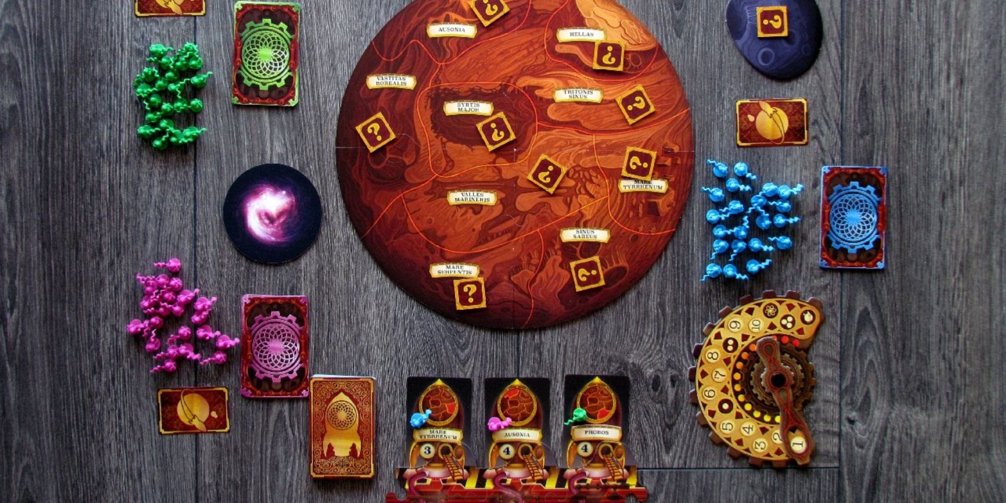 A steampunk-inspired board game showing Victorian-era rockets and astronauts mining resources on a Martian landscape in Mission: Red Planet.