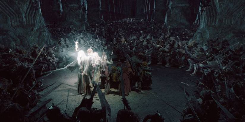 The LOTR fellowship in the Mines of Moria surrounded by Orcs.