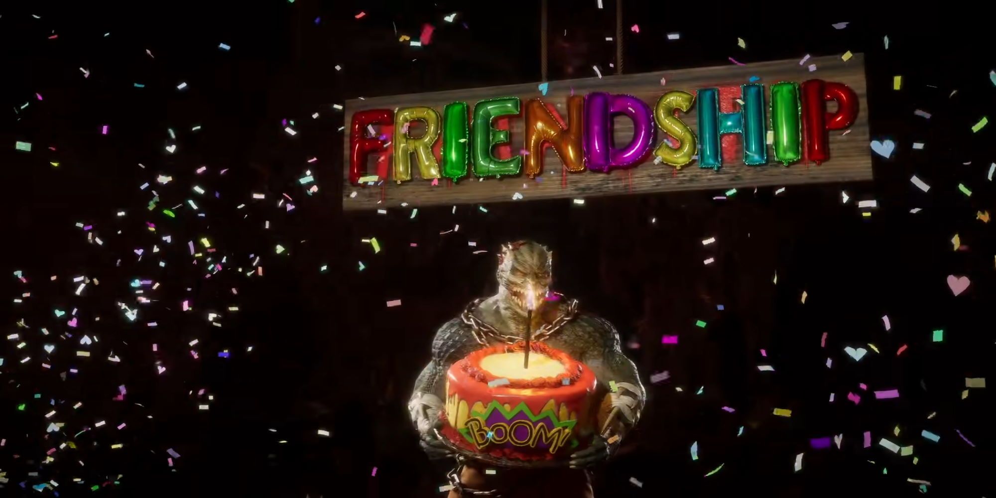 Baraka dressed as Killer Croc holding a cake labelled 'BOOM!' while confetti and a sign saying 'FRIENDSHIP' appears over his head