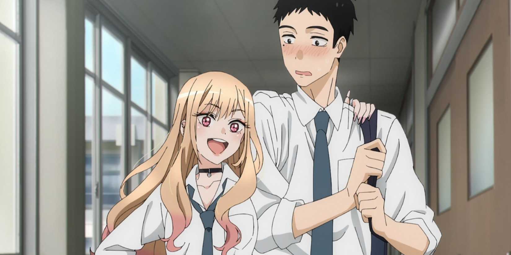 A blonde girl with pink tips in her hair puts her arm around a taller boy in My Dress-Up Darling