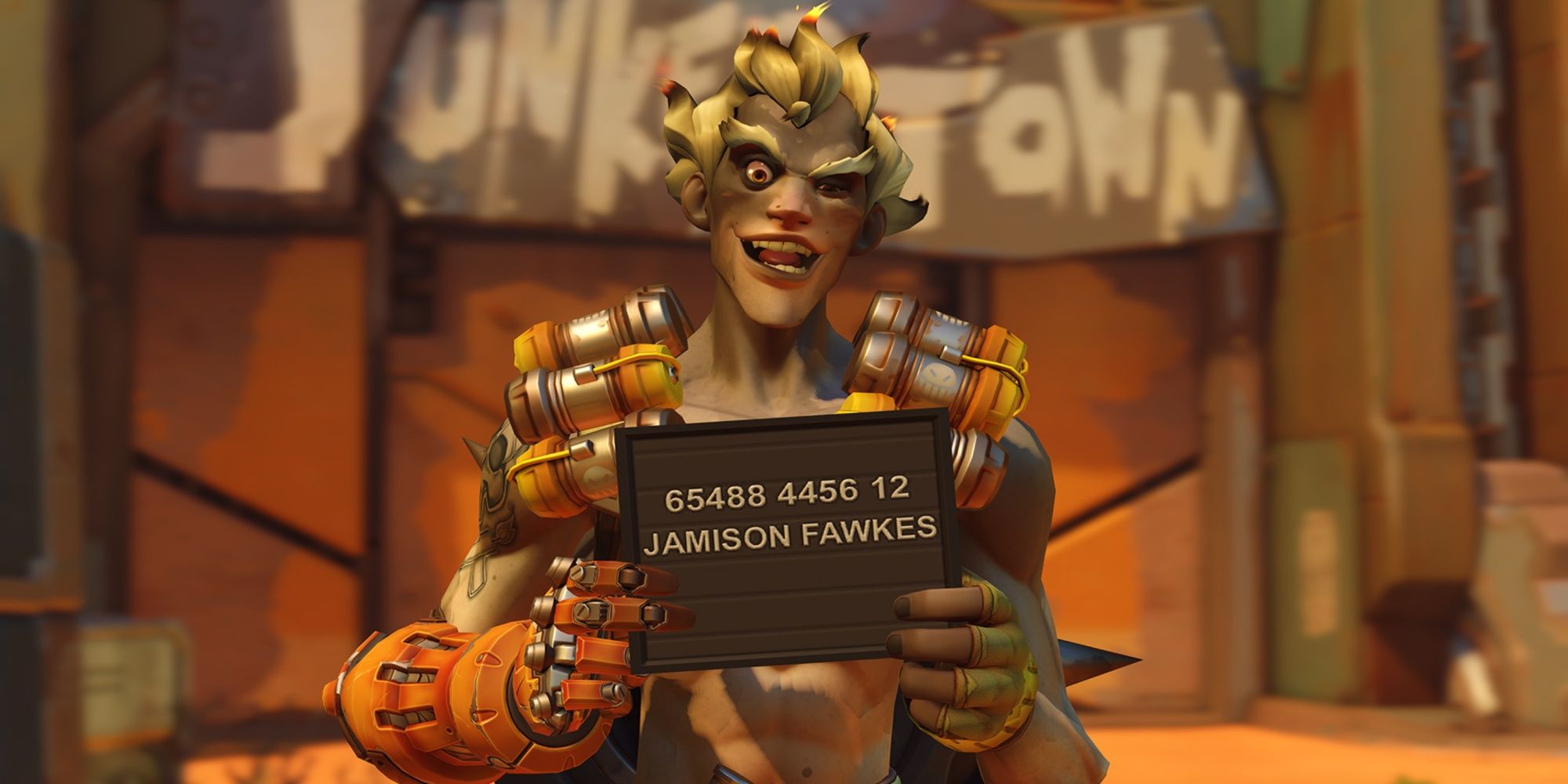 Overwatch 2 Junkrat holds a sign with his legal name, Jamison Fawkes.
