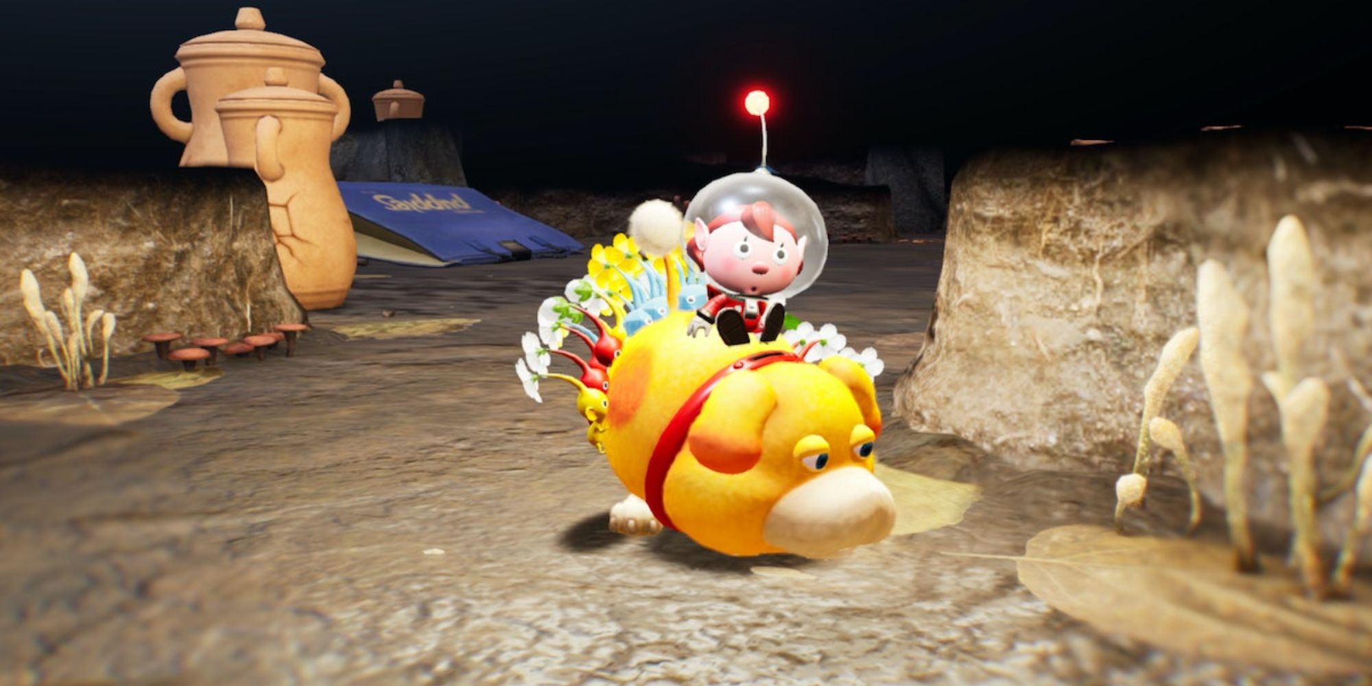 A player character and their Pikmin riding Oatchi at night